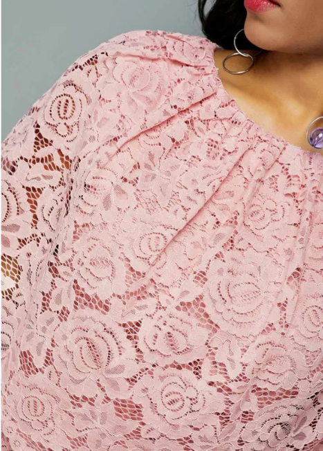 short pink midi dress with lace detailing and short sleeves.