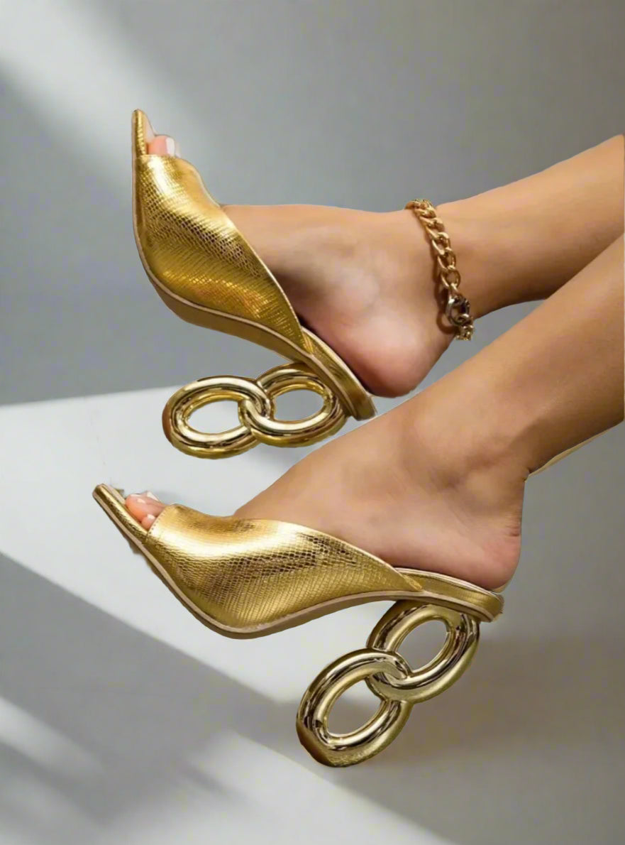 Gold high-heeled shoes with chain design 
