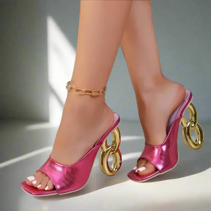 Pink high-heeled shoes with gold rings 