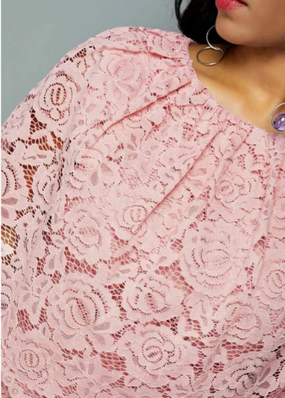 short pink midi dress with lace detailing and short sleeves.