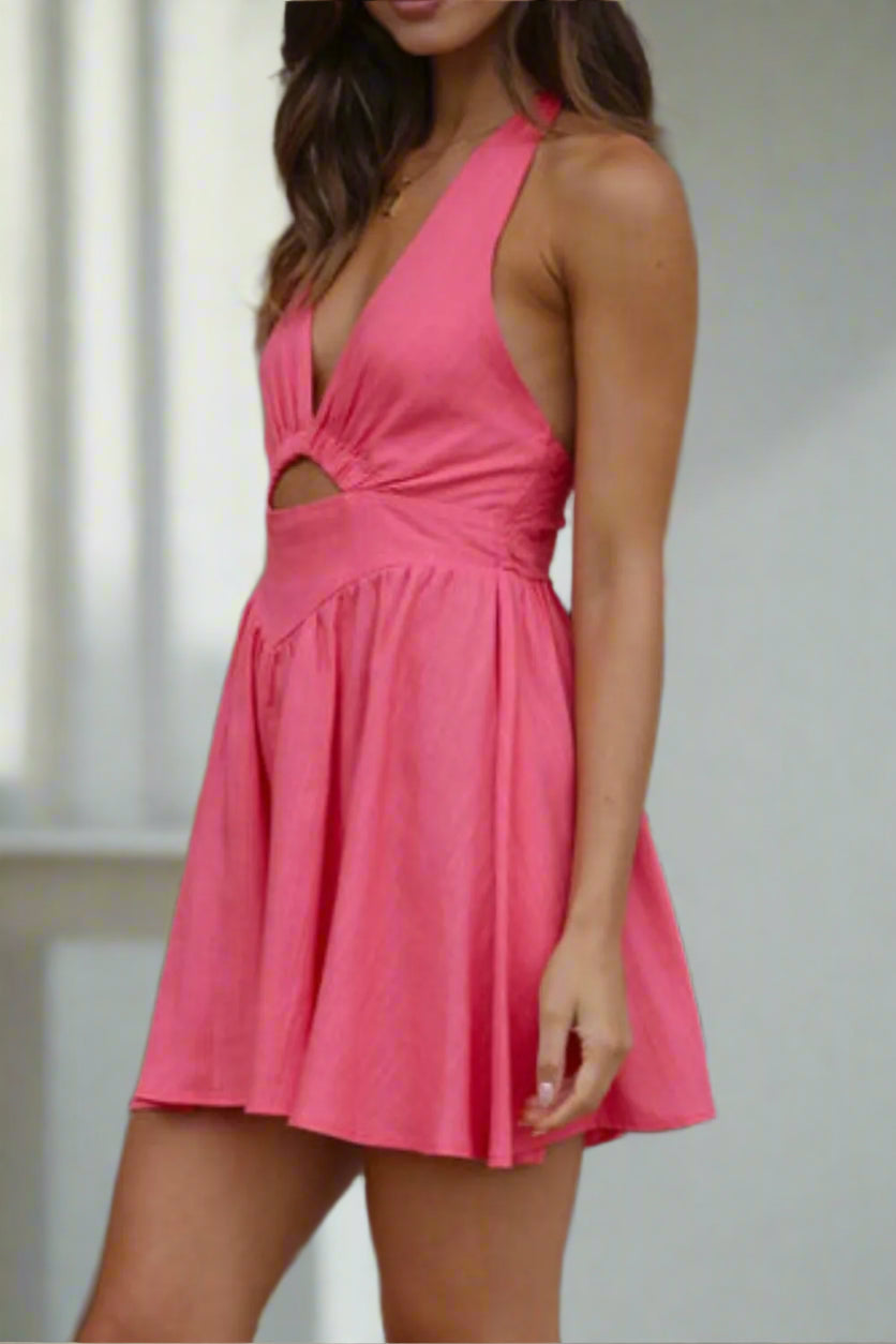 Woman wearing a strawberry dress with a cutout design.