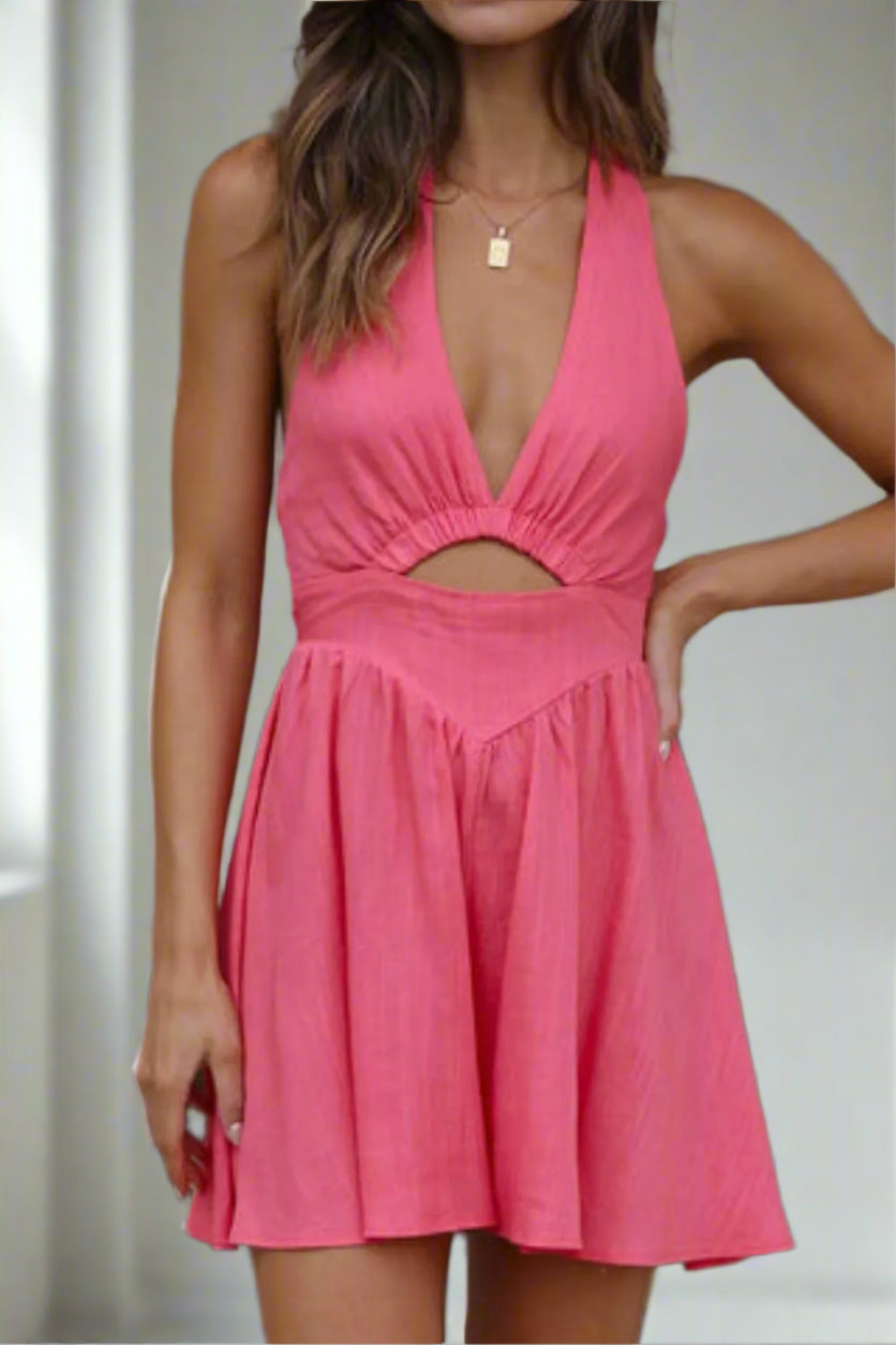Woman wearing a strawberry dress with a cutout design