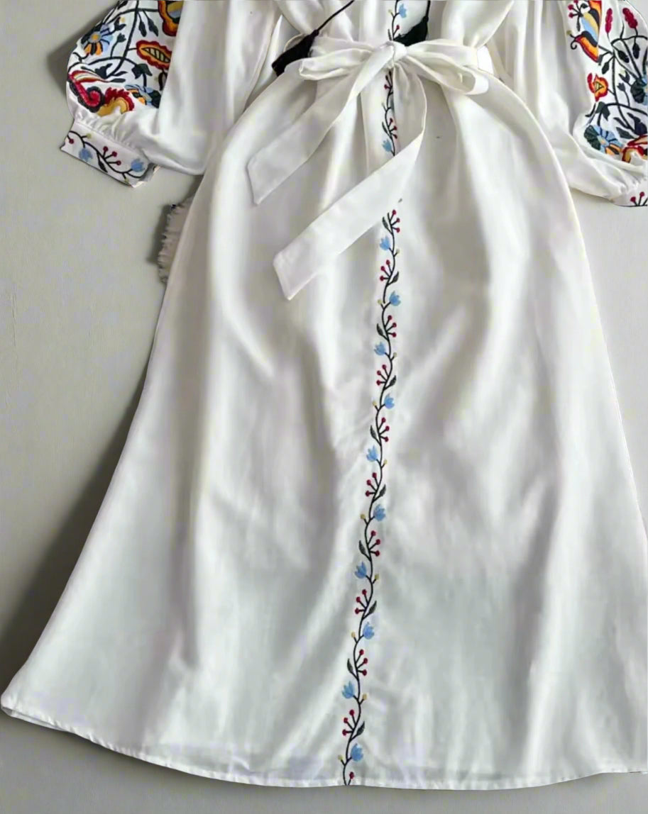 white embroidered midi dress, long sleeves, with adjustable tie