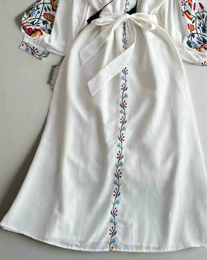 white embroidered midi dress, long sleeves, with adjustable tie